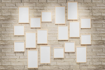3D render illustration of multi size blank photo frames on the sand block bright wall. Empty picture frame mockup