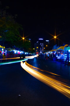 A night neon street at Ben Thanh market in Ho Chi Minh Vietnam wide shot