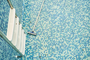 Empty swimming pool with metal ladder. Hotel coronavirus quarantine