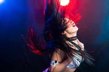 Fototapeta premium Portrait of a woman in oriental costume performing belly dance. Tribal fusion dance concept.