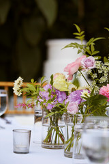 Flowers in glass on restaurant table