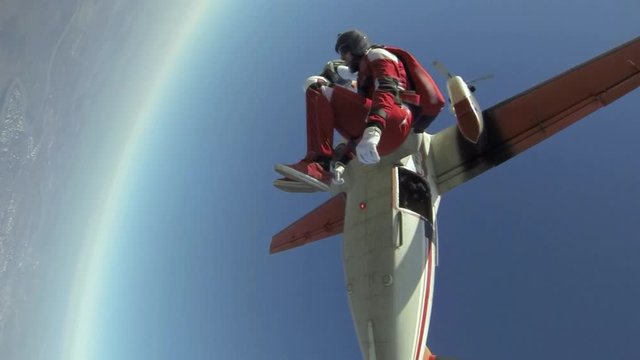Two sports parachutist build a figure in free fall.