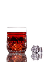 Classic whiskey with ice on a white background. Whiskey and ice. Whiskey in a glass