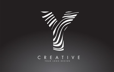 Y Letter Logo Design with Fingerprint, black and white wood or Zebra texture on a Black Background.