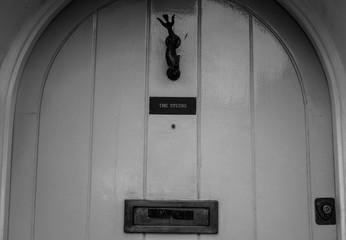 The music studio's door.
Black and white picture of the front door of a music studio in London, UK