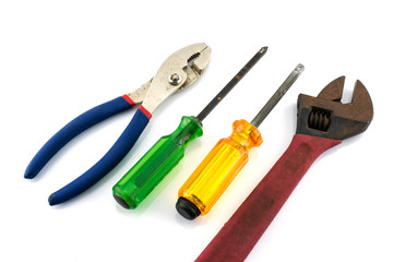 Closeup of various works tools on white background