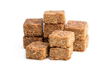 Mini oat and syrup flapjack slices isolated on white