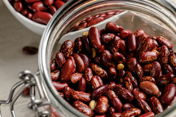 Raw cereals or beans in glass jars close up. Vegan and vegetarian food. Close up.
