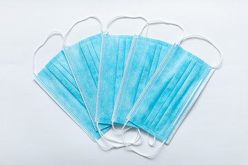 Protective medical mask on a white background. Protection against influenza viruses and coronavirus