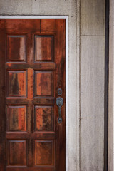 Rusty wooden door wit metal handle