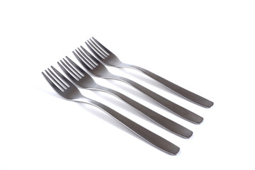 metal forks on a white background. Forks are for eating.