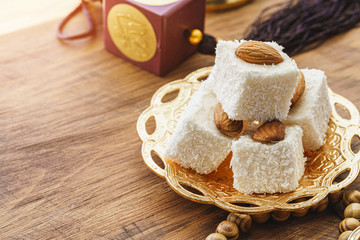 Turkish delight sweets on a metal oriental plate close up