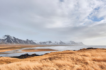 View of coastline and mountains near Budir in Snaefellsnes peninsula (region of Vesturland, Iceland)