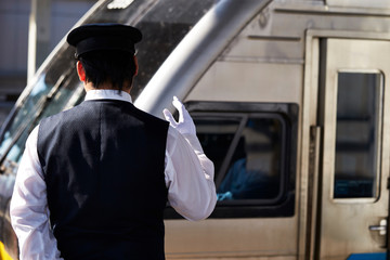 Obraz premium Japanese train conductor at station 