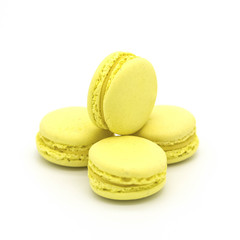 Yellow lemon macarons on a white background