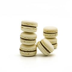 Vanilla with chocolate macaroons on a white background