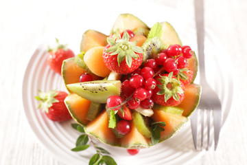 fresh fruit salad in melon bowl