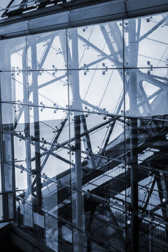 The elevator.
Blue cyanotype dystopian picture of an elevator who's connecting massive buildings in a futuristic megalopolis floating in the air.