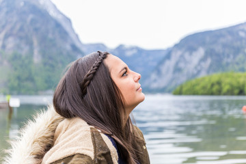 portrait, woman in profile with straight brown hair and a braid