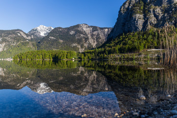 Fototapeta na wymiar lake among mountains reflecting in Austria