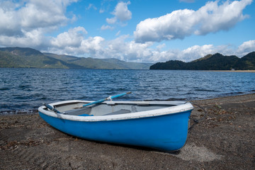 Naklejka premium Boat stop on the beach for tourism service