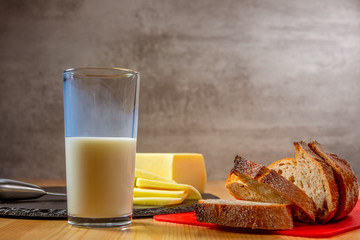 Glass of Milk and Fresh Bread and Cheese