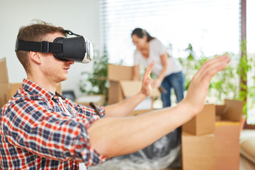 Young man uses virtual reality glasses