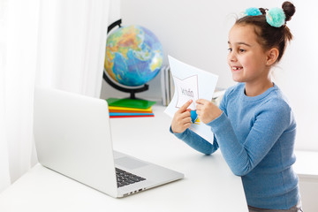 little girl studying art studio on laptop online, distance learning