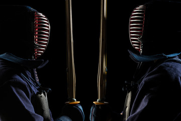 male in tradition kendo armor with shinai (bamboo sword). shot in studio. Isolated with clipping...