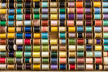 Colorful Spools of Thread. Concept of Missing Piece. Abstract Background. Copy Space for Arts and Crafts