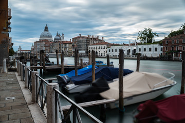 roads and canals in venice italy without crowds in dull weather with speed boats