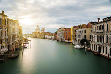 canal grande without boats with outgoing sun behind the markus dome