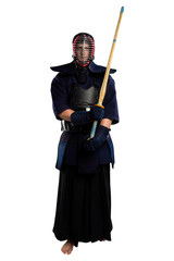 male in tradition kendo armor with shinai (bamboo sword). shot in studio. Isolated with clipping path on white background