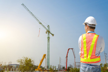 Young male architect on a building construction site