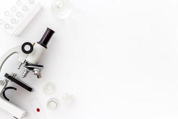 Clinical science research with microscope. Laboratory equipment on white background top view copy...