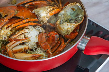 Close-up photo of stir-fried crab with salt and black pepper