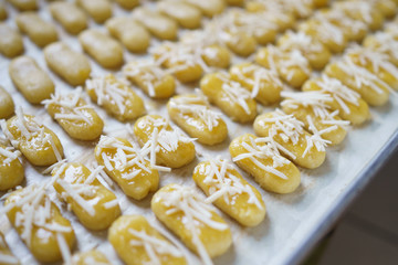 kaasstengels cake. kue kastengel with cheese homemade baking on a tray