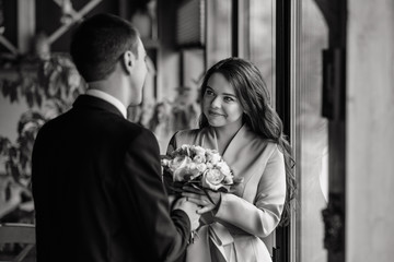 Bride and groom. The first meeting of the bride and groom. First look of wedding couple in the morning at cafe. Wedding couple in love. Bride and groom.