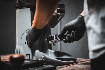 Barista grind coffee to make espresso.