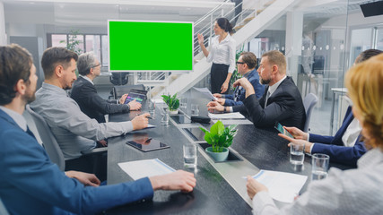 In the Corporate Meeting Room: Female Speaker Uses Digital Chroma Key Interactive Whiteboard for...