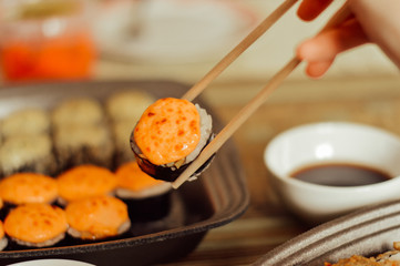 sushi with chopsticks