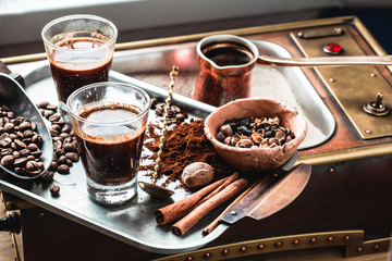 A glass of freshly brewed coffee on the east. Making coffee in the sand in Cezve. Arabica.