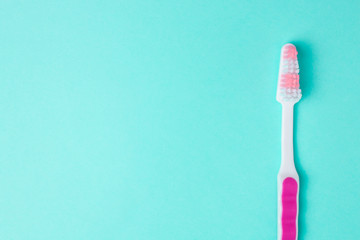 Toothbrush on a blue background with copyspace