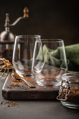 Making of Dalgona coffee in glass cup. Asian trendy drink from instant coffee, milk and ice. Summer beverage concept with copy space.