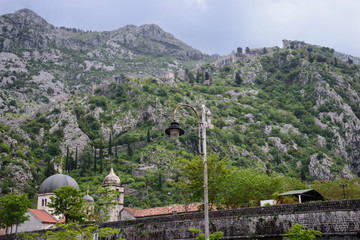 Walled fortification, in the mountains of Kotor, a city located in a bay of the Adriatic Sea, in Montenegro, Europe