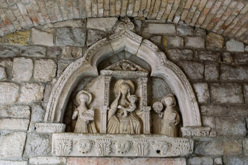 Decorative detail on the stone wall, in Kotor, a city located in a bay of the Adriatic Sea, in Montenegro, Europe.
