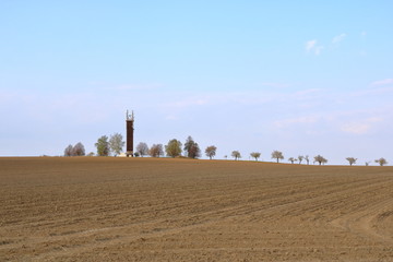 Wooden Telecommunication tower with transmitters. Cellular base station with transmitter antennas...