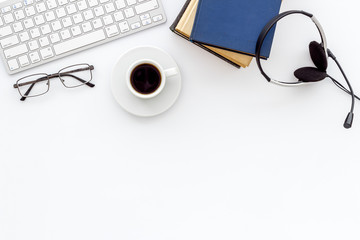 Online education. Books, computer and headphones on white background top-down flat lay copy space