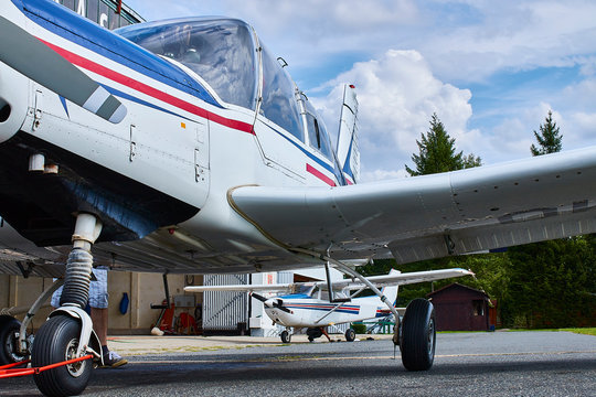 Zbraslavice / Czechia - 08/25/2019: Unusual angle view of Zlin Z-43 four-seat airplane standing on an asphalt runway.  Low-wing monoplane.