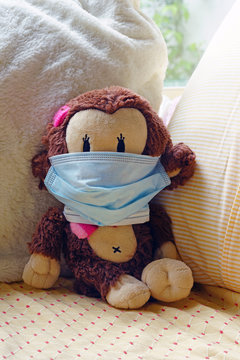 A Childrens Plush Stuffed Animal Toy Wearing A Face Mask During The COVID-19 Pandemic